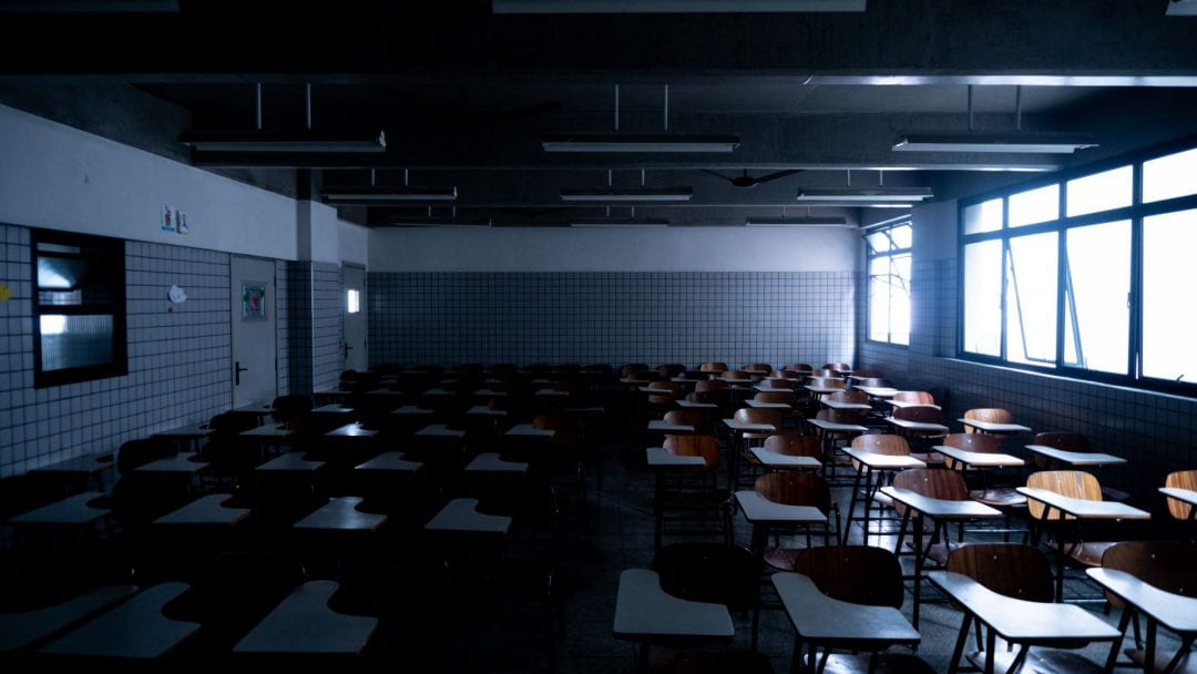 A dark and empty classroom.